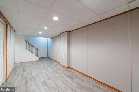 a view of hallway with wooden floor