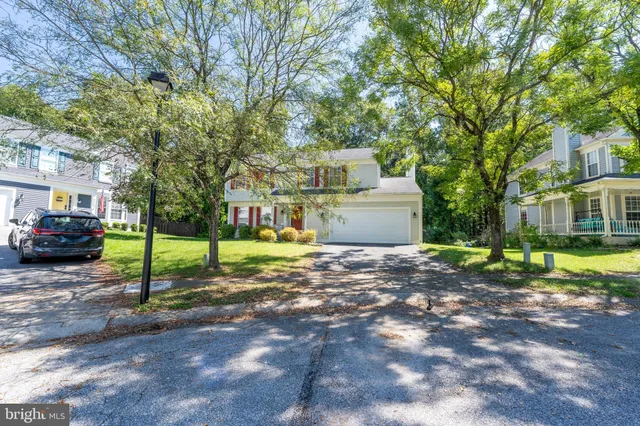 a view of a street with a building and a street sign