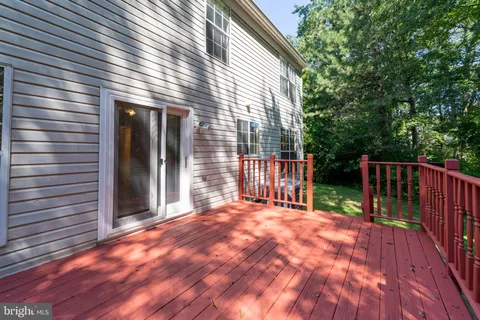 a view of deck with a large trees