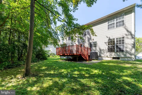 a view of a backyard with sitting area