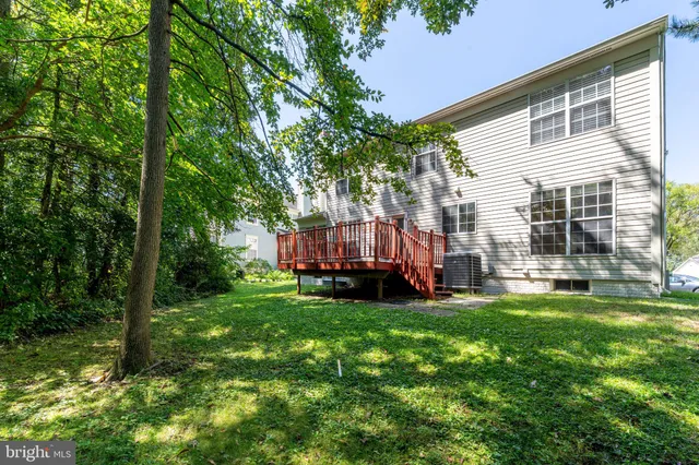 a view of a backyard with sitting area