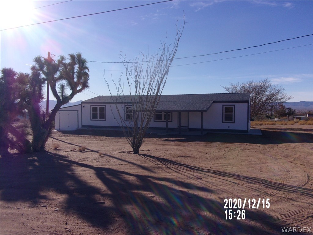3553 Tooman Road Golden Valley, AZ 86413 - Photo 3 of 38 a view of a house with a snow on the road