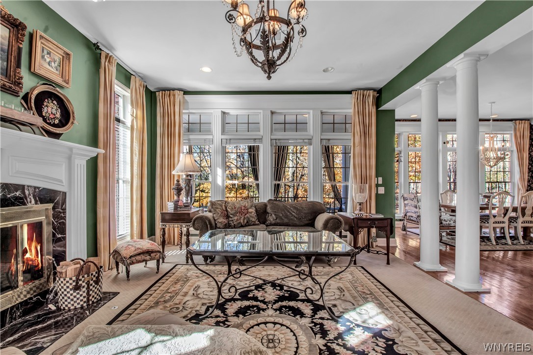 9590 Cobblestone Drive Clarence, NY 14031 - Photo 11 of 42 Family room overlooks backyard and kitchen