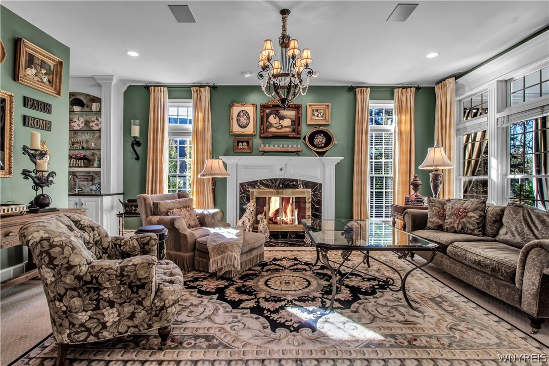 9590 Cobblestone Drive Clarence, NY 14031 - Photo 12 of 42 Family room with fireplace