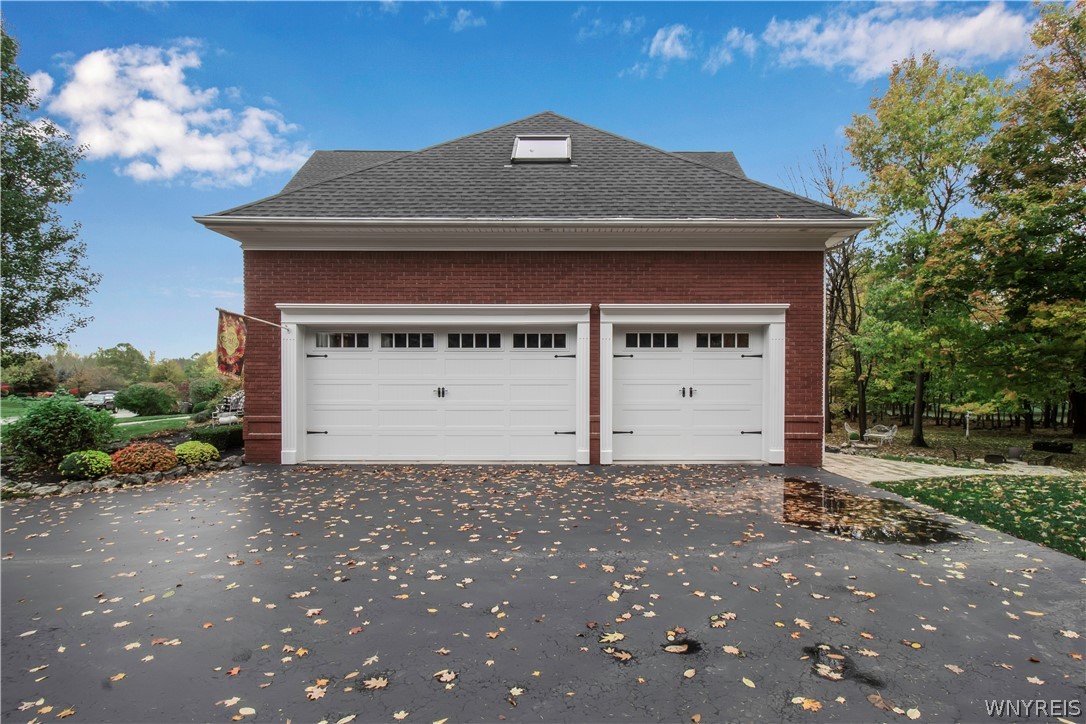 9590 Cobblestone Drive Clarence, NY 14031 - Photo 38 of 42 Three car attached garage
