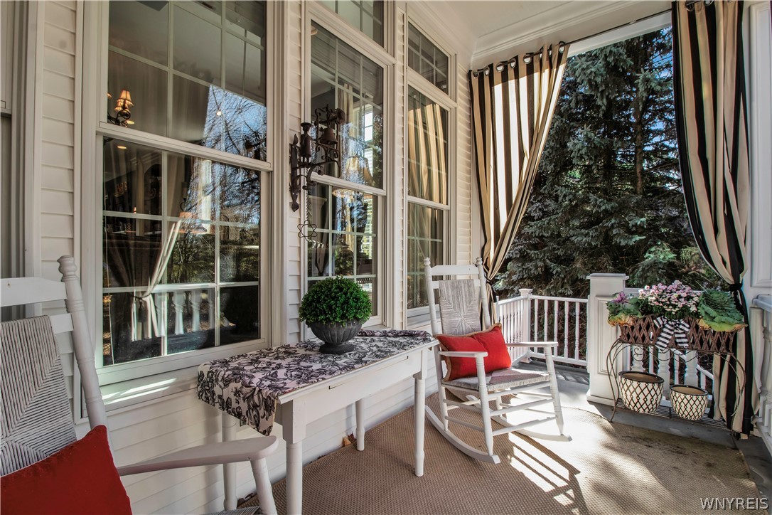 9590 Cobblestone Drive Clarence, NY 14031 - Photo 5 of 42 Covered back porch off the kitchen