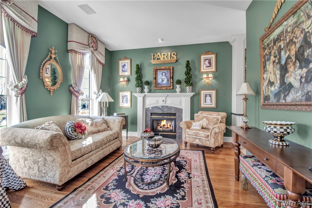 9590 Cobblestone Drive Clarence, NY 14031 - Photo 6 of 42 Living room with fireplace