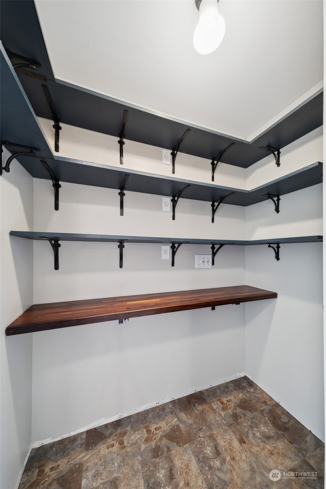 15044 Southeast 113th Street Renton, WA 98059 - Photo 18 of 26 a view of a room with racks on the wall
