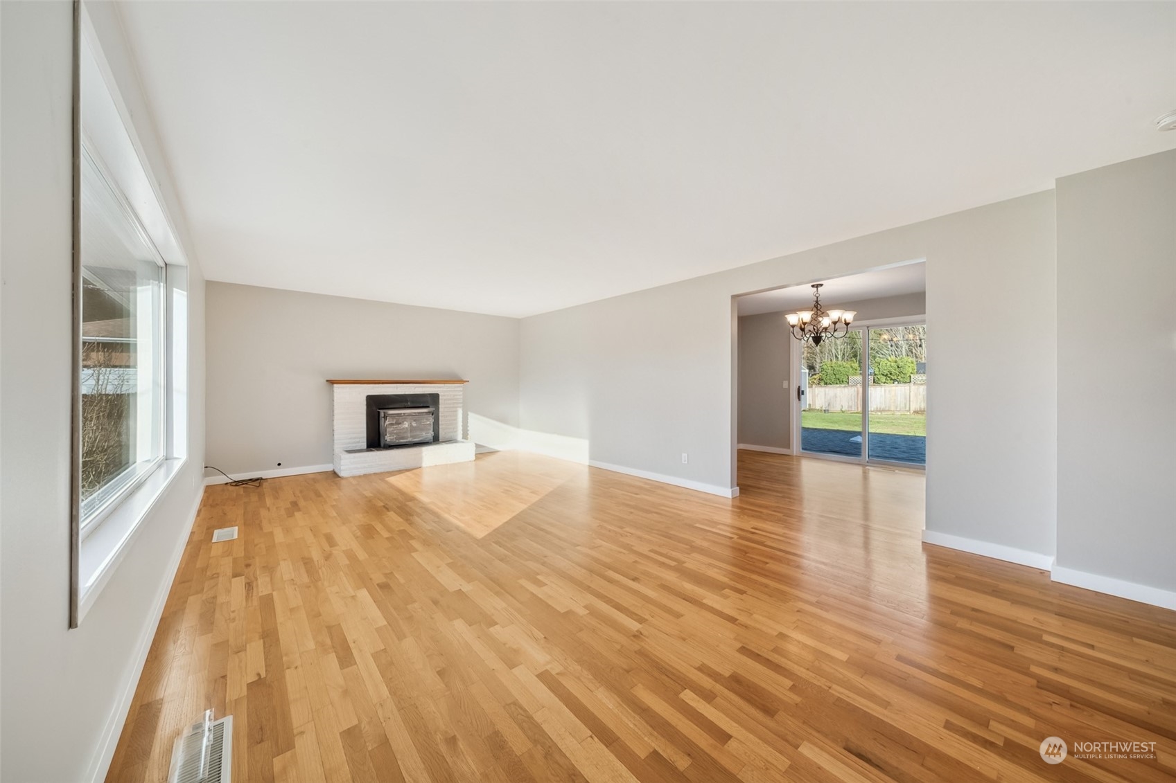 15044 Southeast 113th Street Renton, WA 98059 - Photo 5 of 26 a view of empty room with wooden floor and fan
