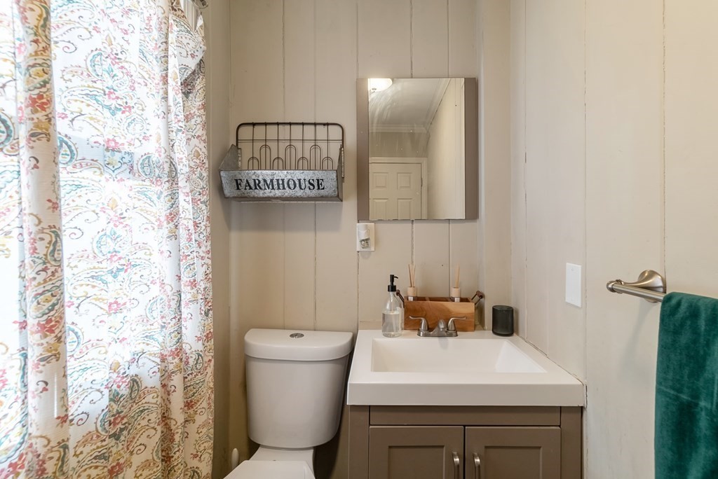 68 Abbott Street Springfield, MA 01118 - Photo 13 of 28 a bathroom with a sink and a mirror