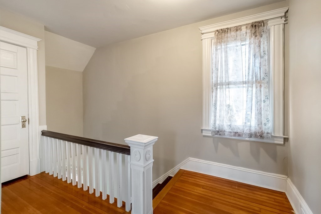 68 Abbott Street Springfield, MA 01118 - Photo 20 of 28 a view of a room with wooden floor and chair
