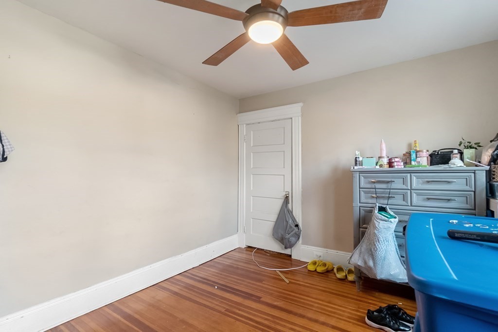 68 Abbott Street Springfield, MA 01118 - Photo 23 of 28 a room with a bed and a chandelier