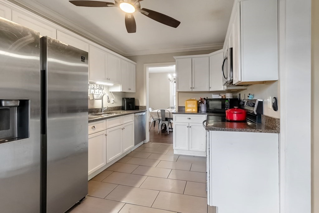 68 Abbott Street Springfield, MA 01118 - Photo 6 of 28 a kitchen with cabinets and stainless steel appliances