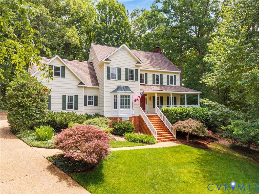 2011 Gamelaw Court Midlothian, VA 23113 - Photo 4 of 77 a front view of a house with a yard
