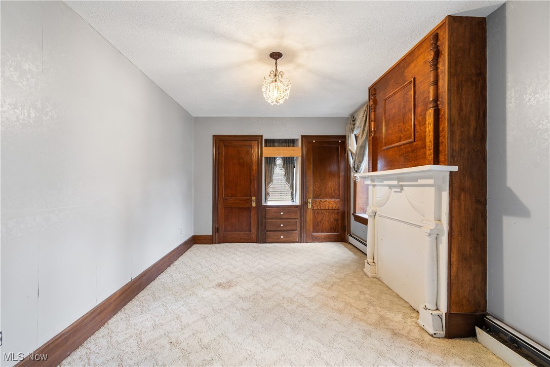 5147 Bluebird Road Northwest Malvern, OH 44644 - Photo 19 of 26 Bedroom with fireplace