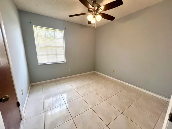 a kitchen with stainless steel appliances granite countertop a refrigerator a stove a sink a microwave and a refrigerator