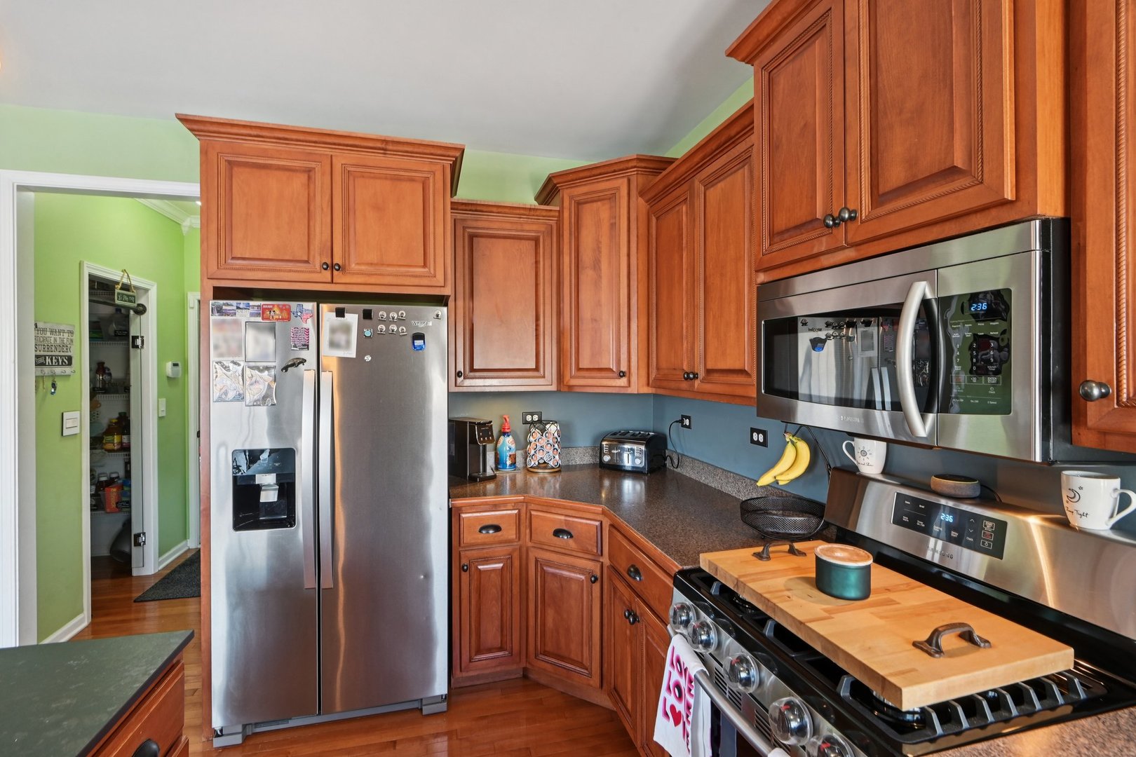 16385 Celtic Circle Manhattan, IL 60442 - Photo 14 of 49 a kitchen with stainless steel appliances granite countertop a refrigerator and a stove top oven