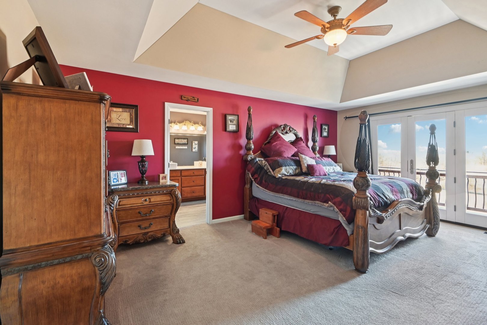 16385 Celtic Circle Manhattan, IL 60442 - Photo 25 of 49 a bedroom with a bed and a chandelier