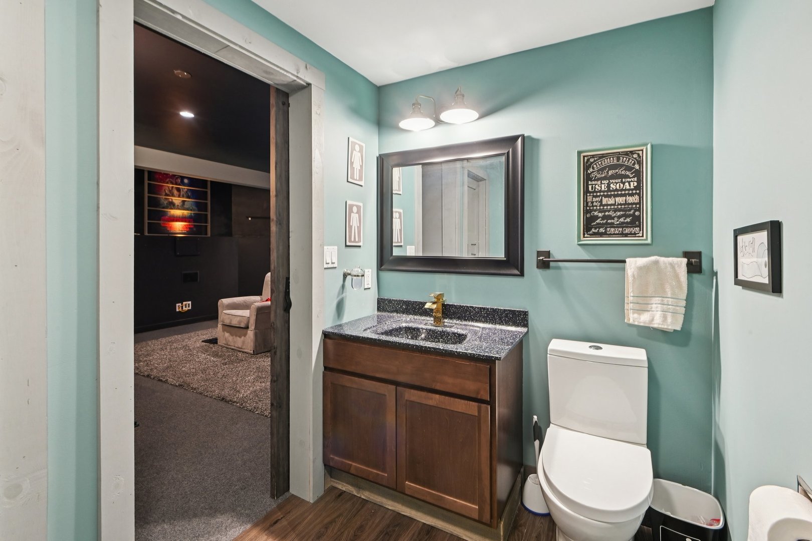 16385 Celtic Circle Manhattan, IL 60442 - Photo 40 of 49 a bathroom with a toilet a sink and mirror