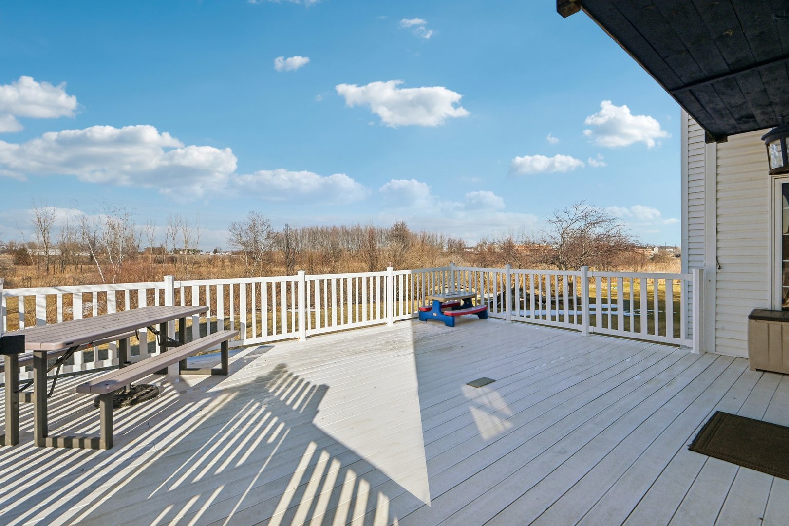 16385 Celtic Circle Manhattan, IL 60442 - Photo 43 of 49 a view of a balcony with wooden floor