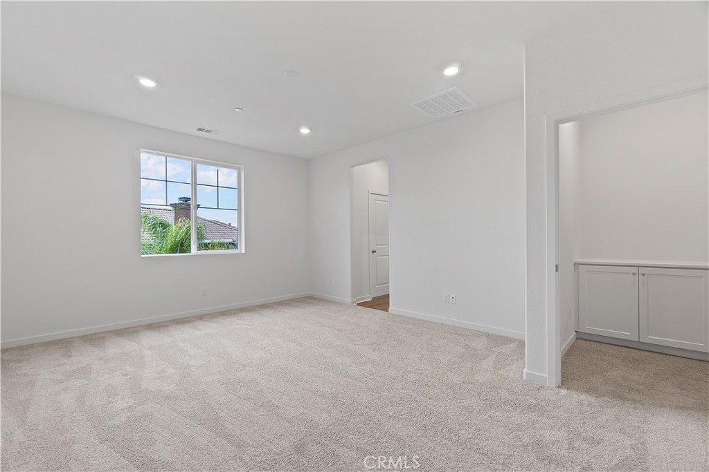12764 Clifton Way Yucaipa, CA 92399 - Photo 12 of 24 an empty room with windows