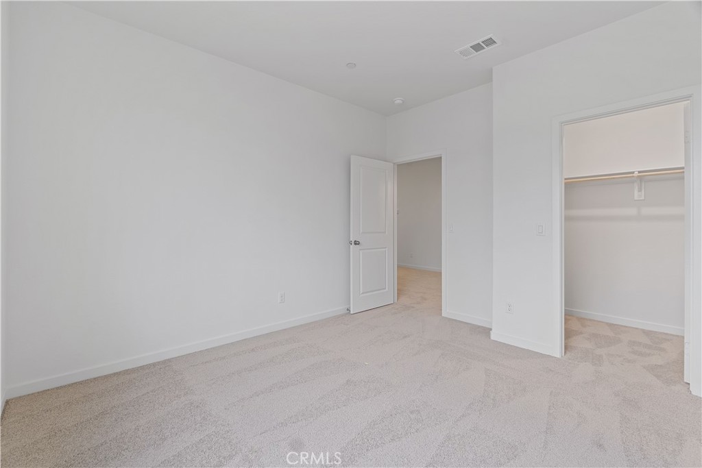 12764 Clifton Way Yucaipa, CA 92399 - Photo 15 of 24 an empty room with an entryway