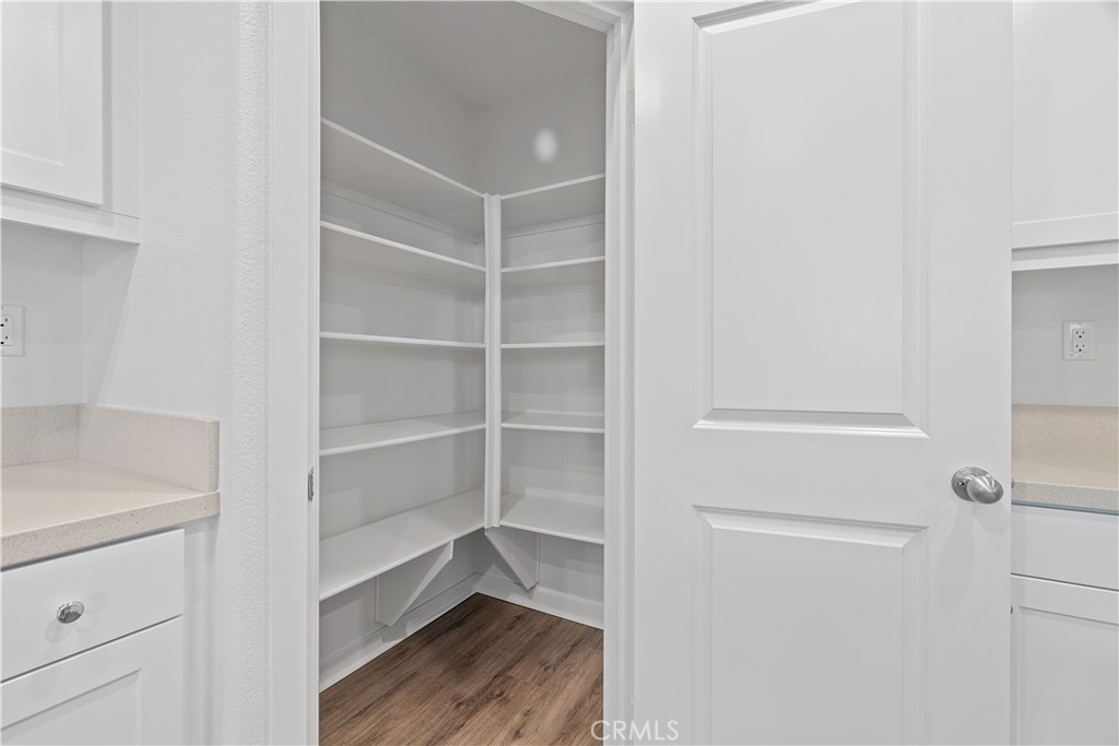 12764 Clifton Way Yucaipa, CA 92399 - Photo 6 of 24 a view of walk in closet with empty racks