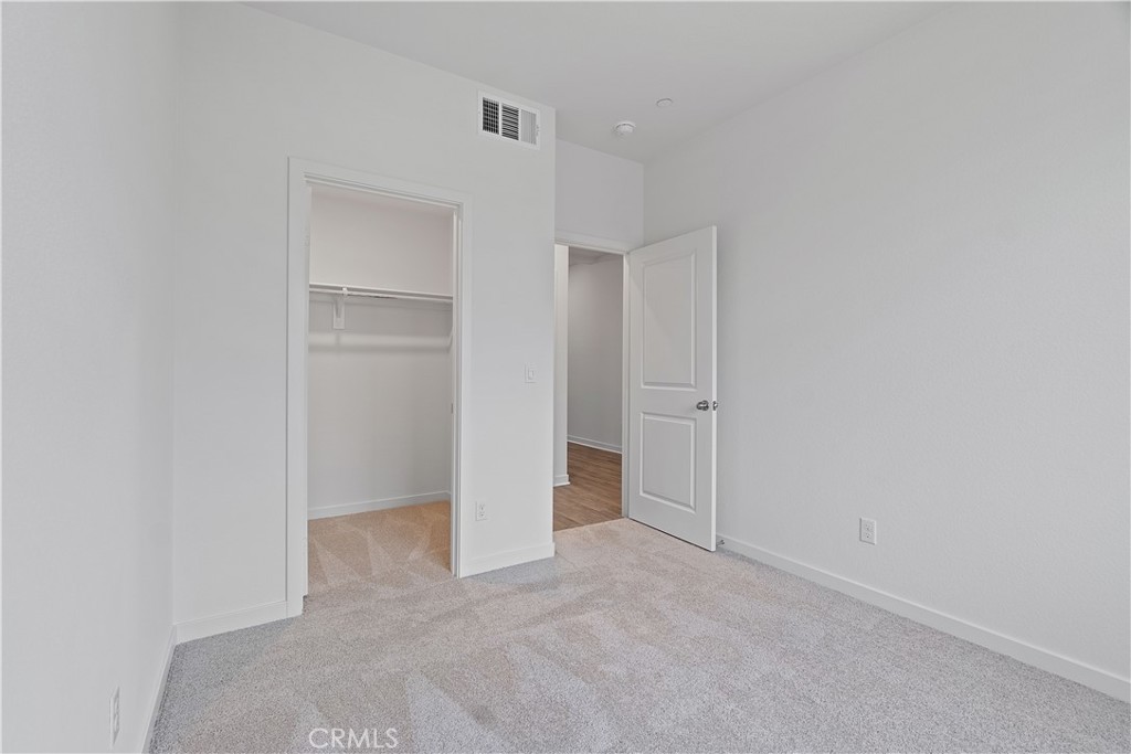 12764 Clifton Way Yucaipa, CA 92399 - Photo 7 of 24 a view of an empty room