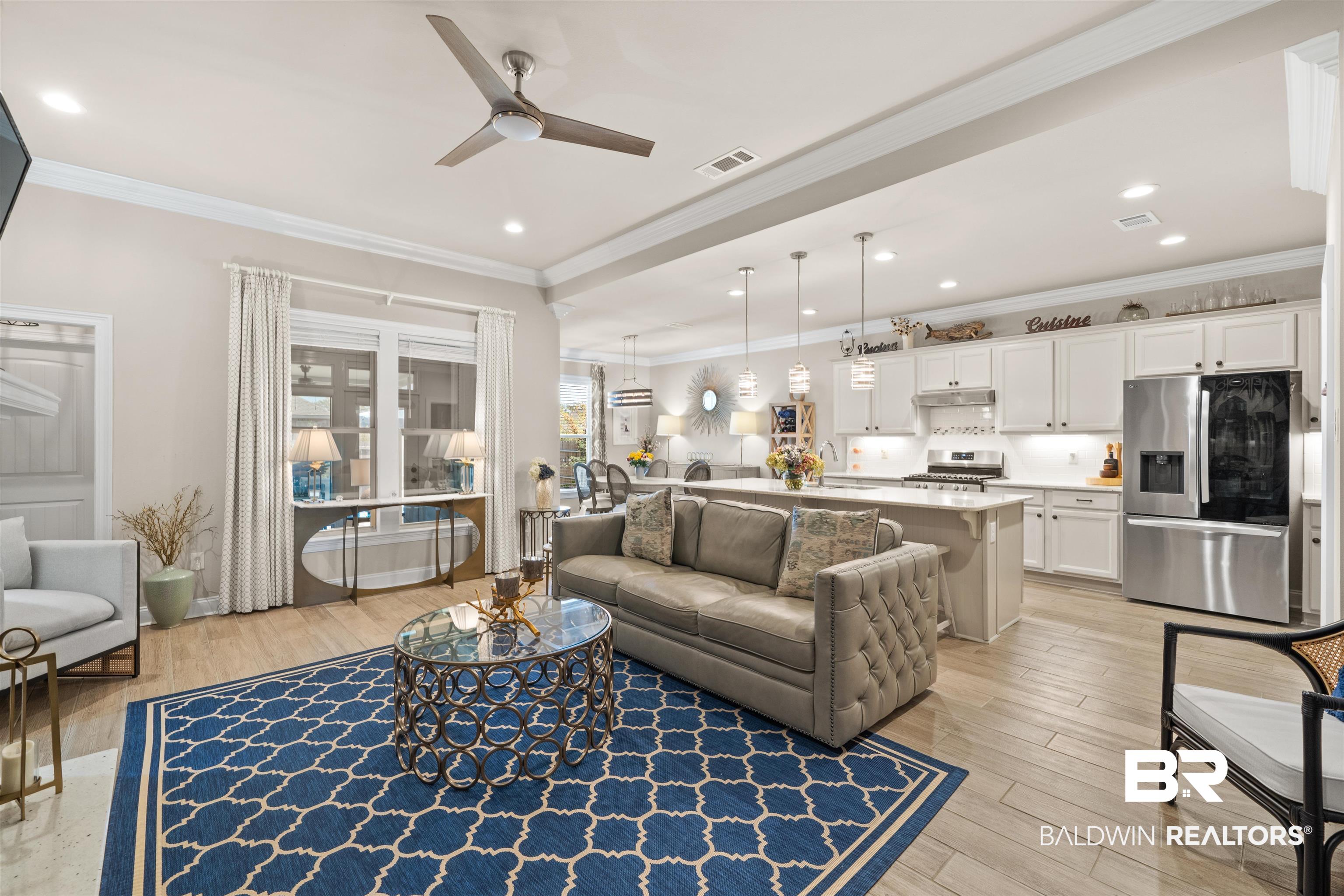 1509 Fenton Circle Foley, AL 36535 - Photo 7 of 34 Living area featuring visible vents, ceiling fan, ornamental molding, recessed lighting, and light wood-style floors