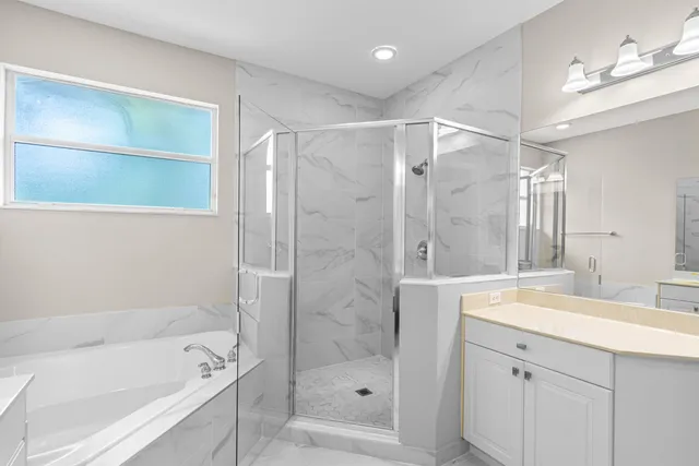 a bathroom with a shower bathtub and a sink