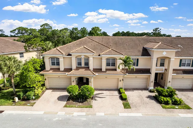 front view of a house with a garden
