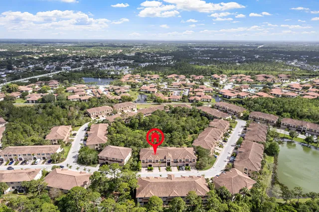 an aerial view of residential houses with outdoor space