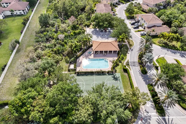 an aerial view of residential houses with outdoor space