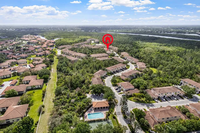 an aerial view of residential houses with outdoor space