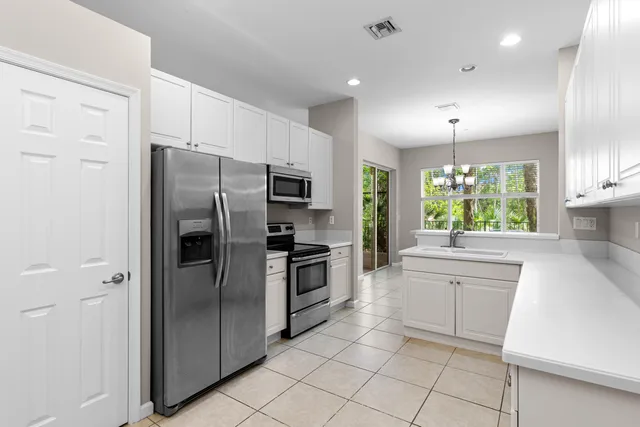 a kitchen with a refrigerator a sink and dishwasher