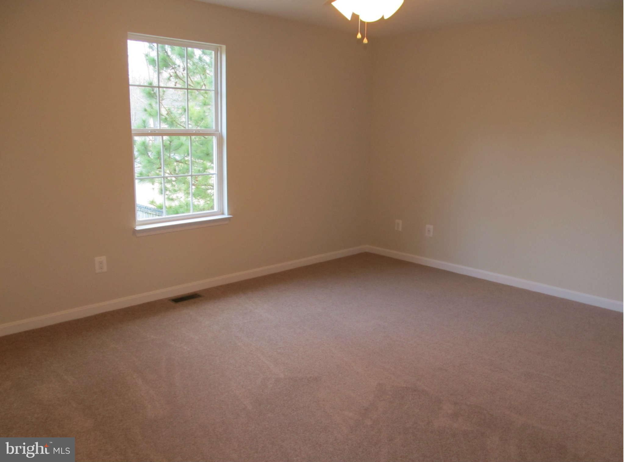 12554 Santa Rosa Road Lusby, MD 20657 - Photo 9 of 23 an empty room with a window