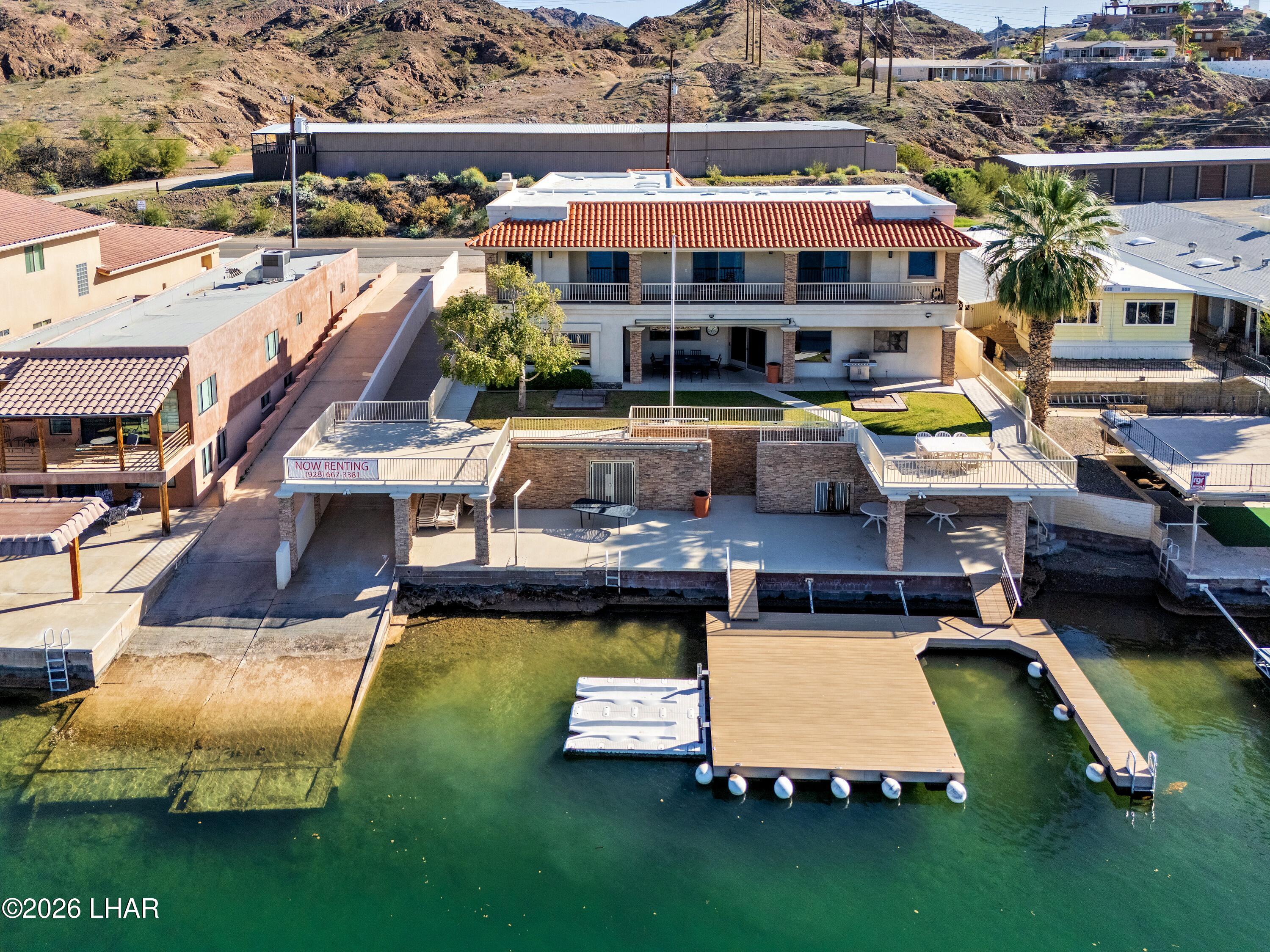 6674 Riverside Drive Parker, AZ 85344 - Photo 1 of 57 an aerial view of a house with swimming pool garden and patio