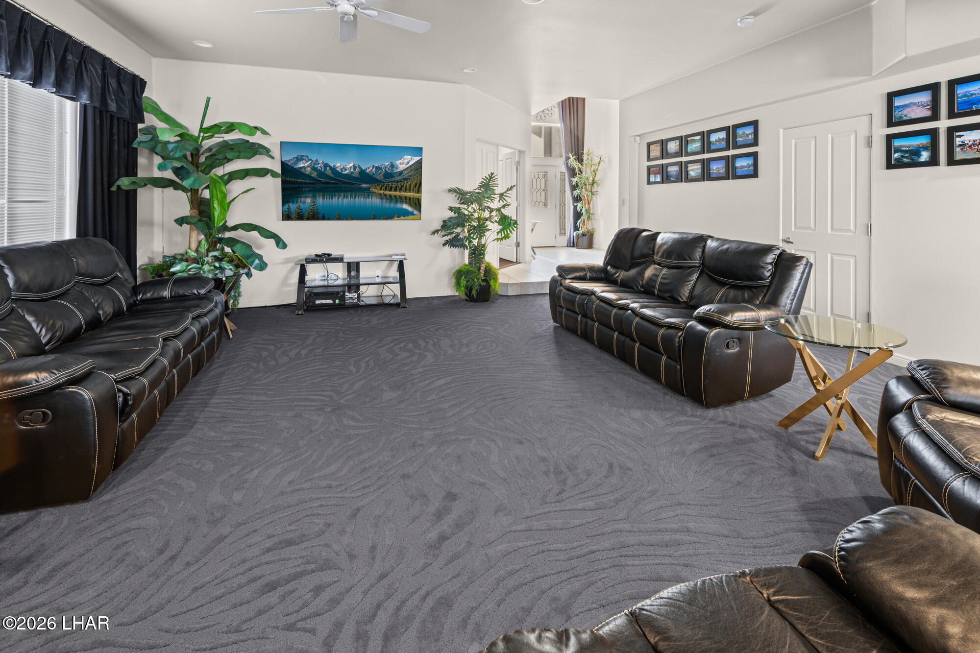 6674 Riverside Drive Parker, AZ 85344 - Photo 25 of 57 a living room with furniture and a flat screen tv