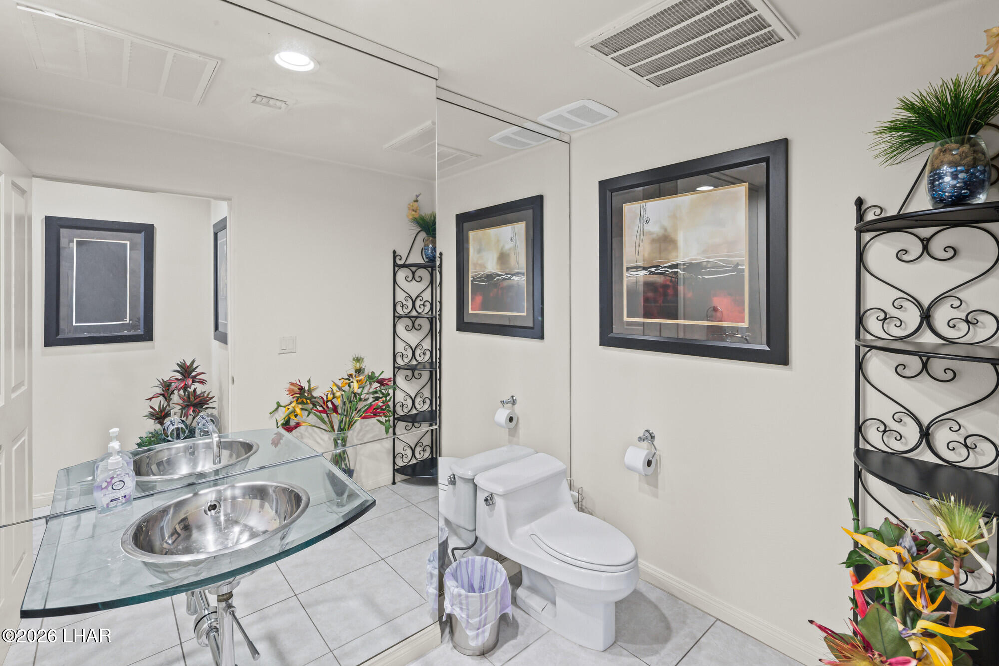 6674 Riverside Drive Parker, AZ 85344 - Photo 29 of 57 a bathroom with a sink mirror vanity and toilet