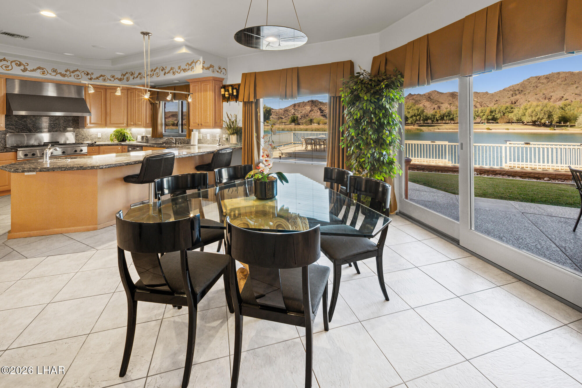 6674 Riverside Drive Parker, AZ 85344 - Photo 31 of 57 a view of a dining room with furniture window and outside view