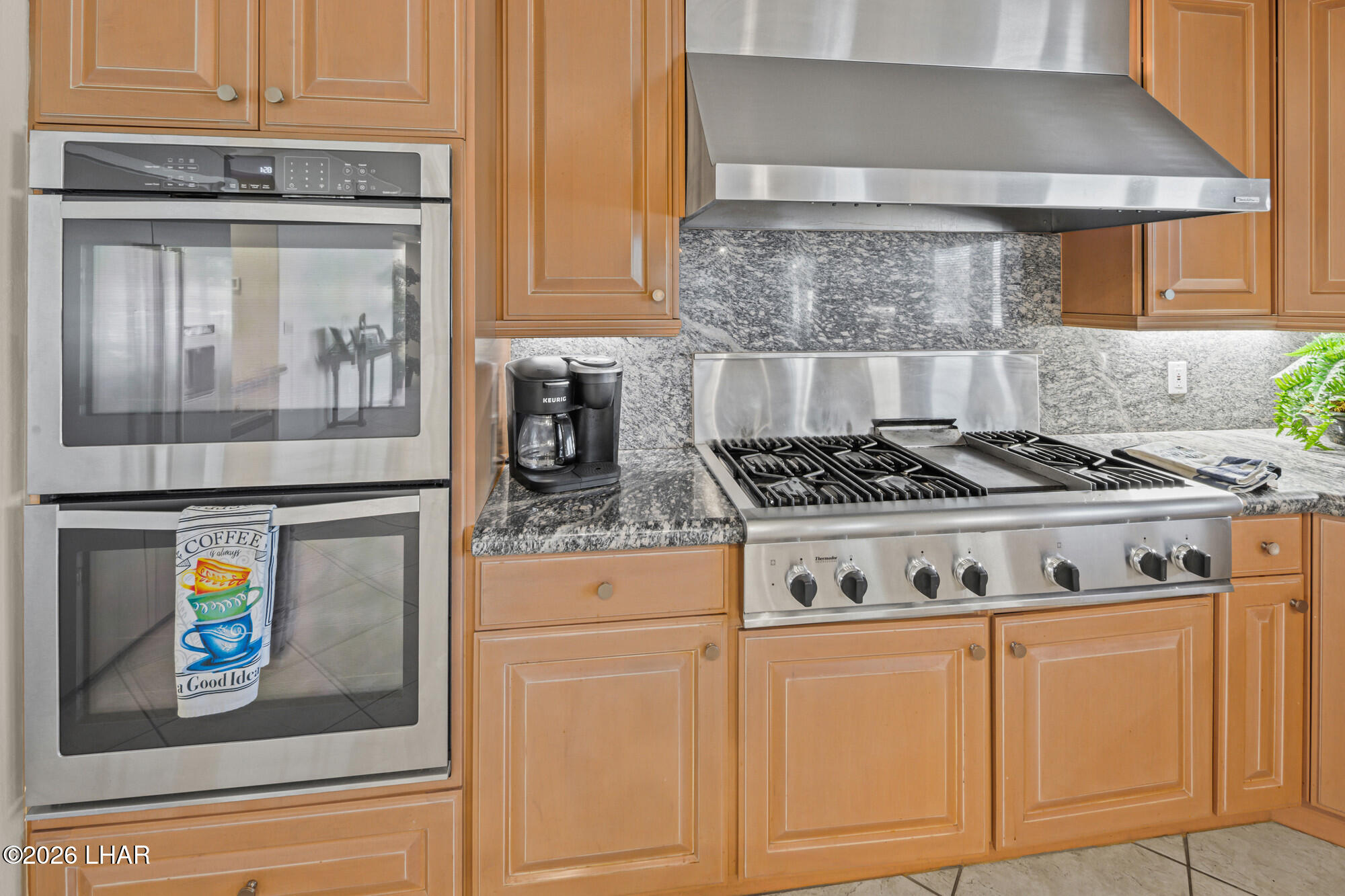 6674 Riverside Drive Parker, AZ 85344 - Photo 34 of 57 a white stove top oven sitting inside of a kitchen