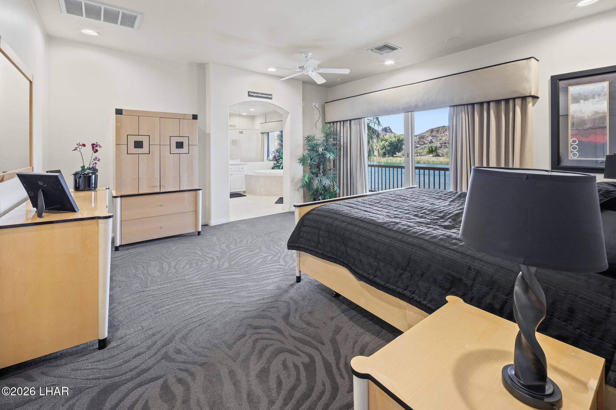 6674 Riverside Drive Parker, AZ 85344 - Photo 40 of 57 a bed room with a bed and a television