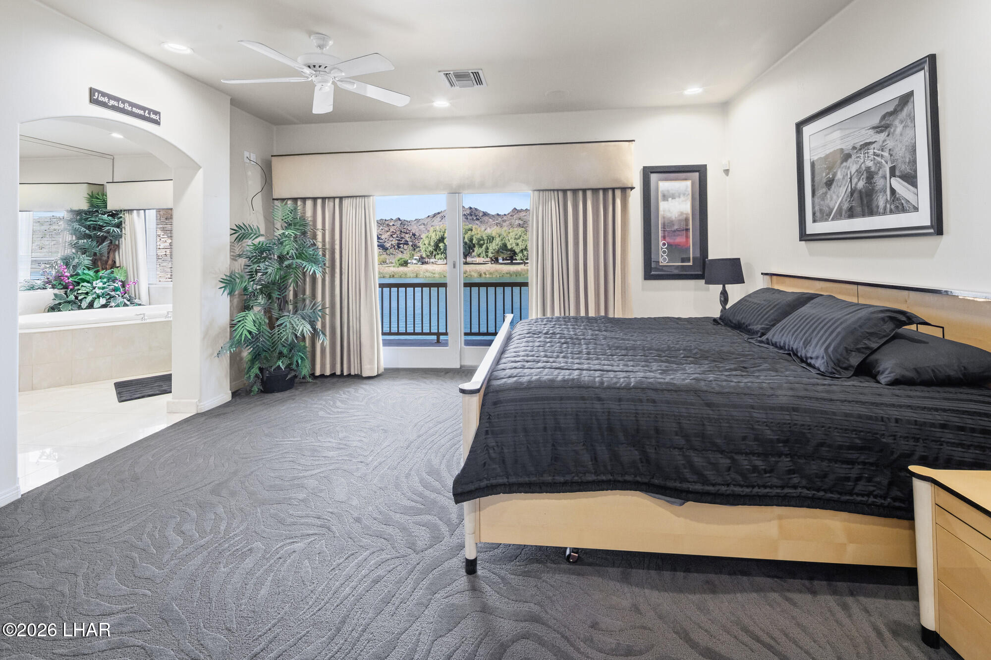 6674 Riverside Drive Parker, AZ 85344 - Photo 42 of 57 a bedroom with a large bed and a large window