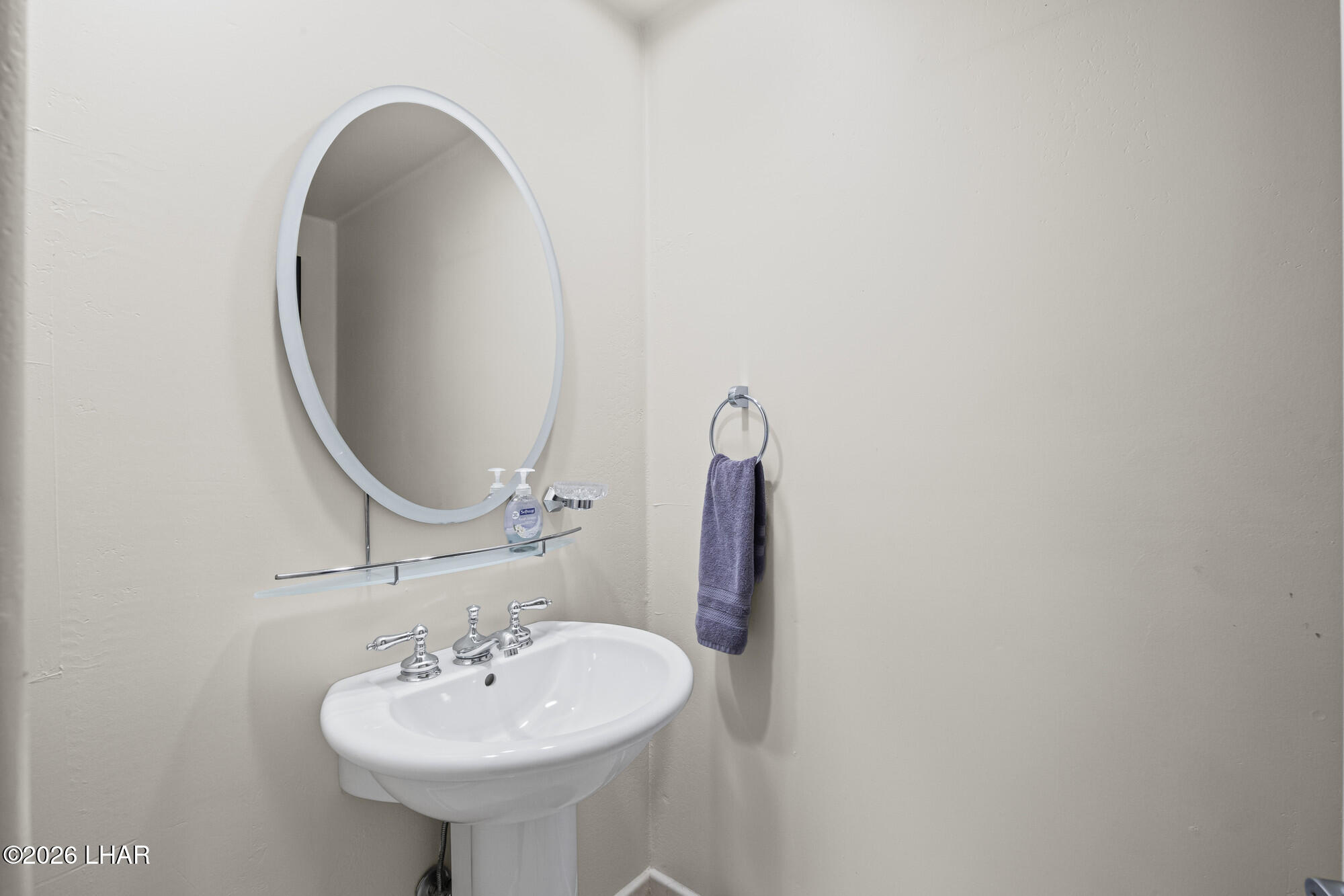 6674 Riverside Drive Parker, AZ 85344 - Photo 48 of 57 a bathroom with a sink and a mirror