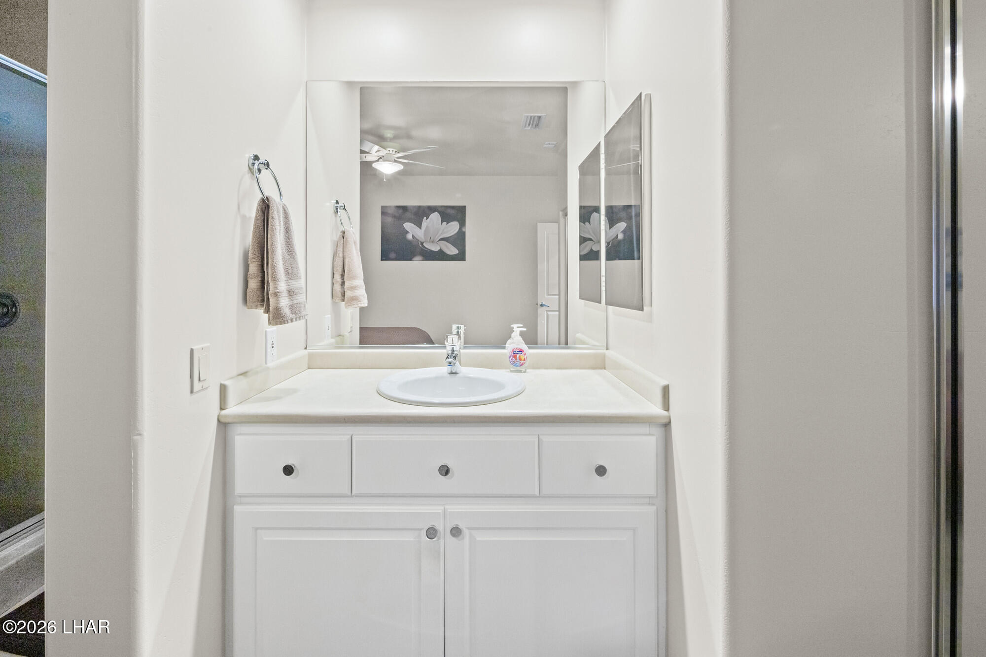 6674 Riverside Drive Parker, AZ 85344 - Photo 54 of 57 a bathroom with a sink and a mirror
