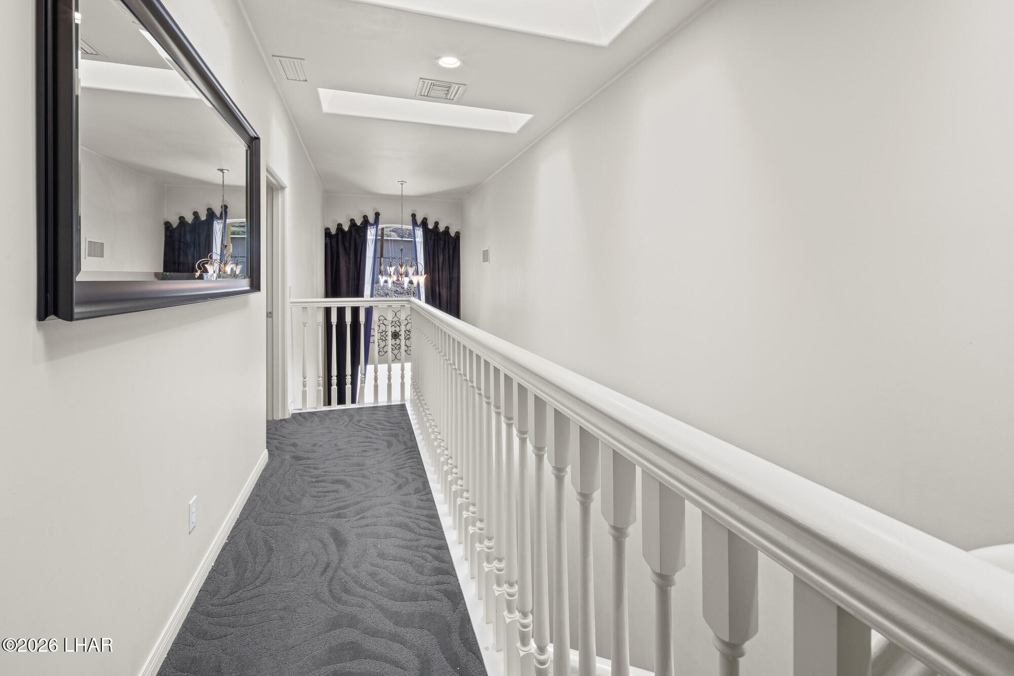 6674 Riverside Drive Parker, AZ 85344 - Photo 55 of 57 a view of a hallway with wooden floor