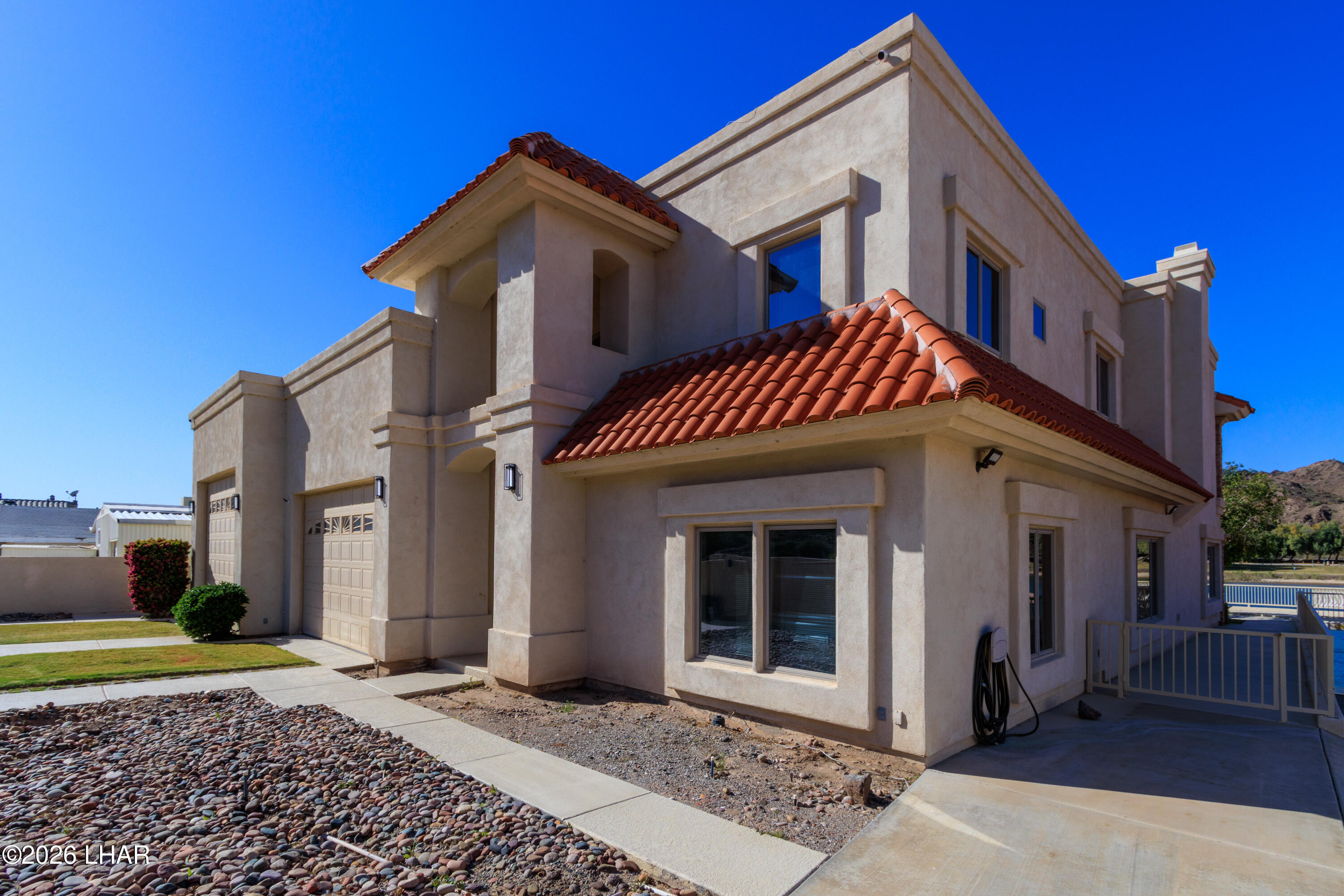 6674 Riverside Drive Parker, AZ 85344 - Photo 8 of 57 a front view of a house with a yard