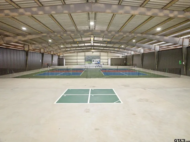 swimming pool view with a lake view