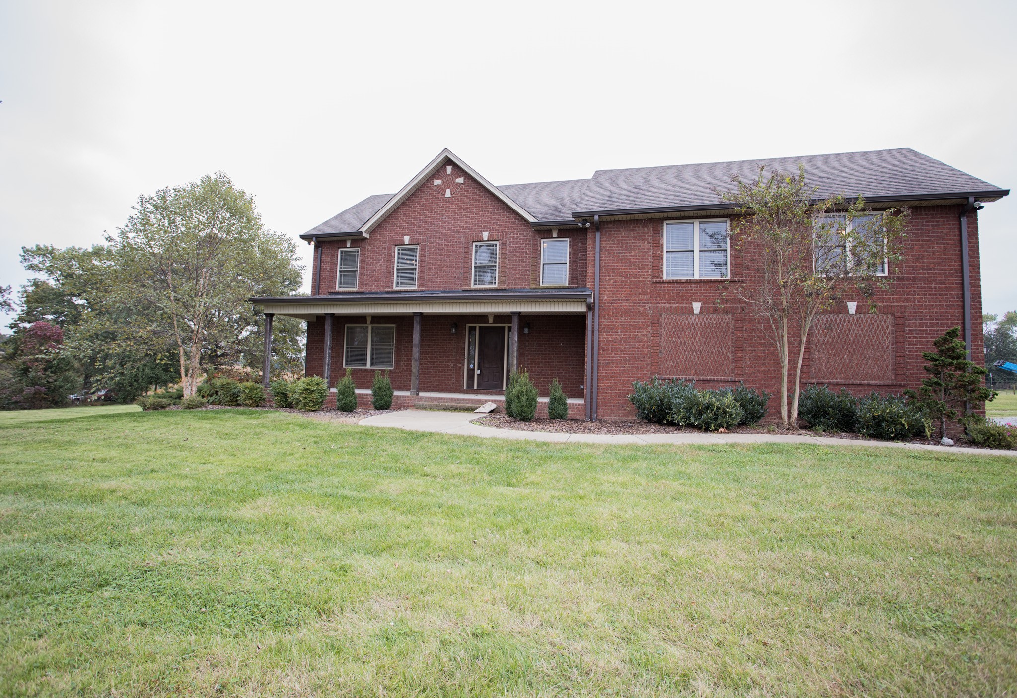 5325 Fred Perry Road Springfield, TN 37172 - Photo 1 of 26 a front view of a house with a garden