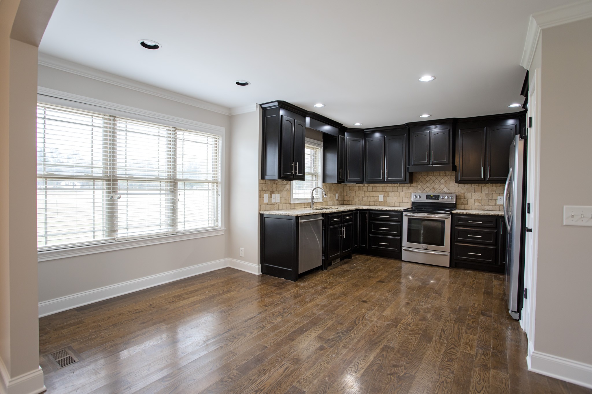 5325 Fred Perry Road Springfield, TN 37172 - Photo 5 of 26 a kitchen with stainless steel appliances a refrigerator a sink a stove a microwave and cabinets